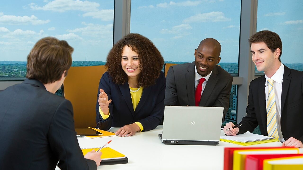four shell employees in a meeting