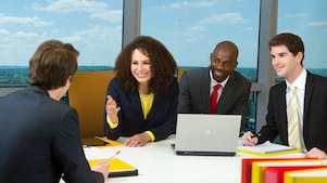 four shell employees in a meeting