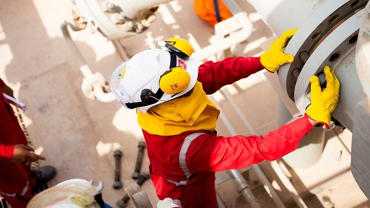 Worker wearing safety mask and gloves