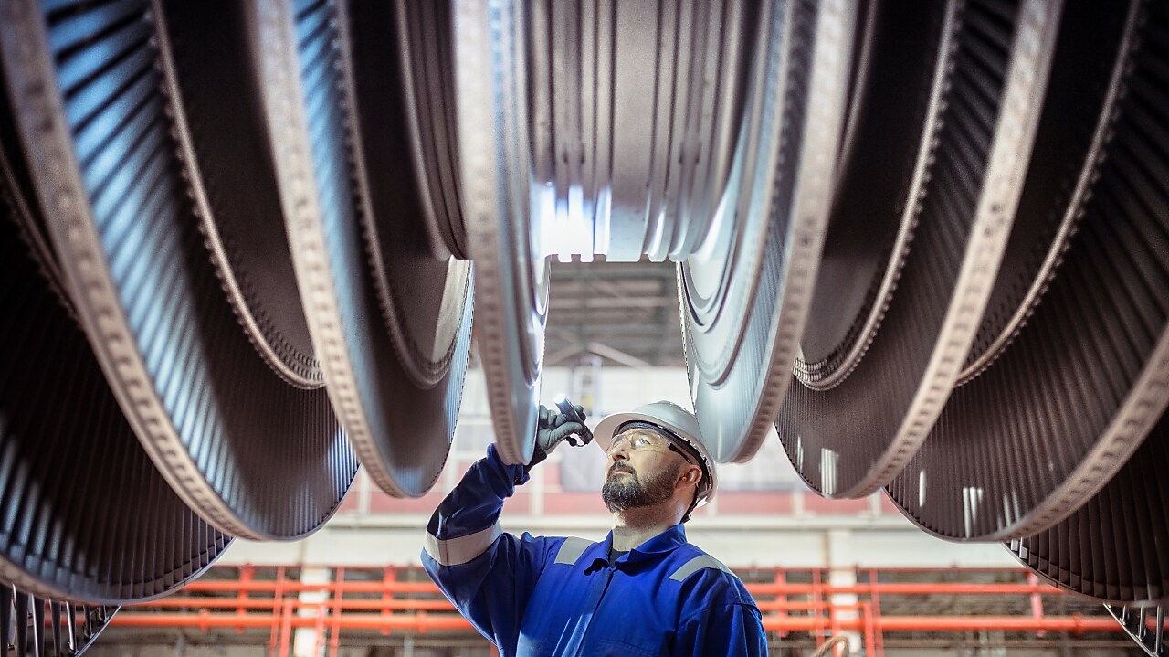 Engineer inspecting a turbine in a nuclear power station